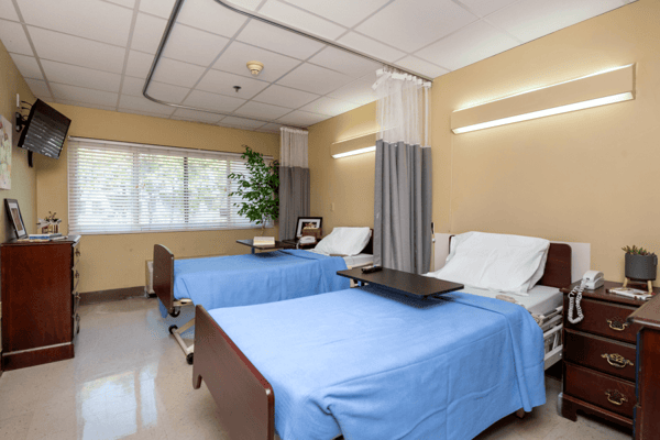 Interior photo of a shared resident room with two beds