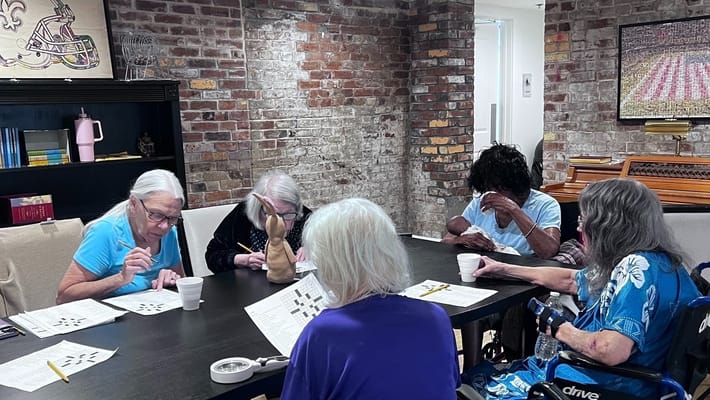 Residents engaged in a group activity at a table