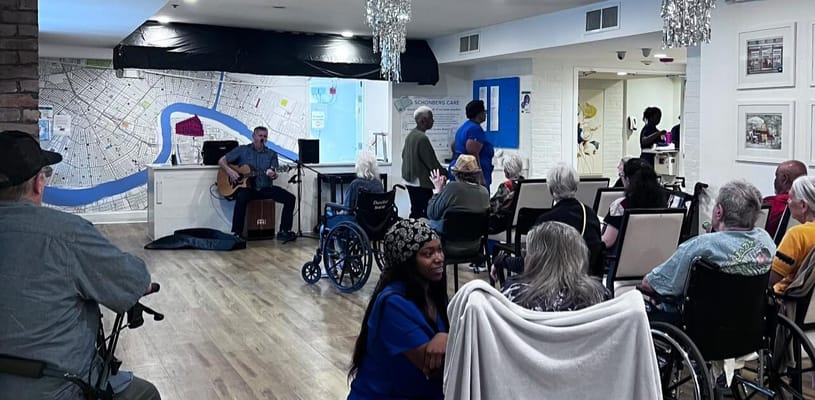 Residents enjoying live music in a common area
