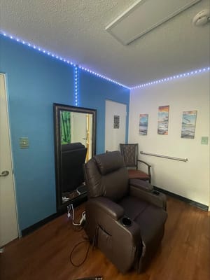 Cozy interior room with a recliner and mirror