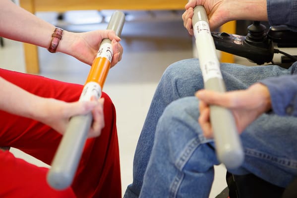 Two individuals engaging in a therapeutic activity