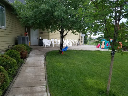 Outdoor seating area with path and trees