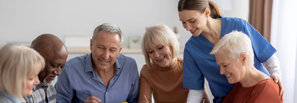 Residents and staff engaged in an activity together
