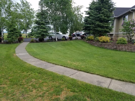 Well-maintained garden with a curving path near the facility