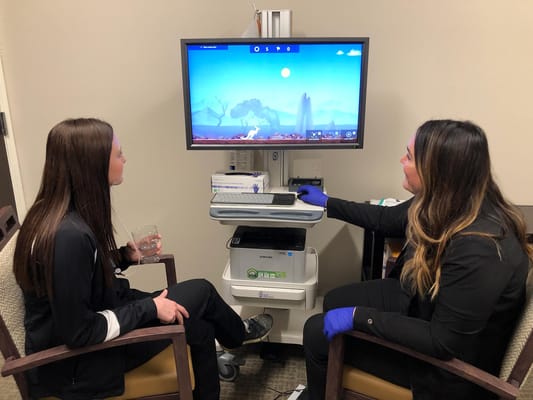 Two women engaging with a virtual therapy session