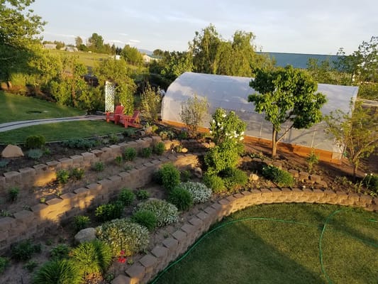 Lush garden area with raised beds and greenery