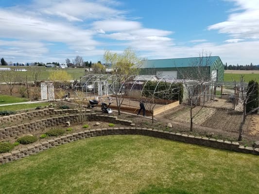 Garden area with staff working in the background