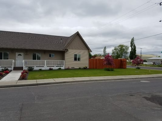 Exterior view of a senior care facility with landscaping