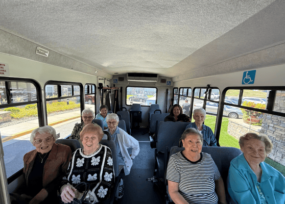 Group of residents enjoying a bus ride together