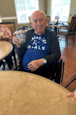 Resident enjoying ice cream in the community room