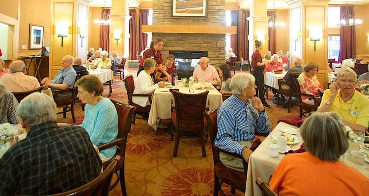 Residents enjoying a meal in the dining room