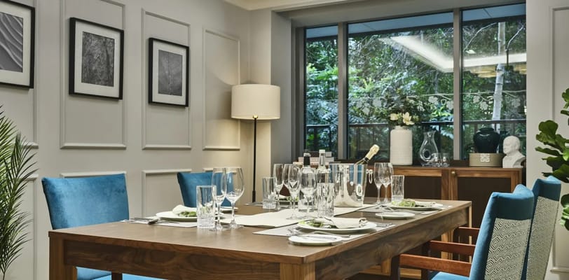 Elegant dining area with natural light and decor