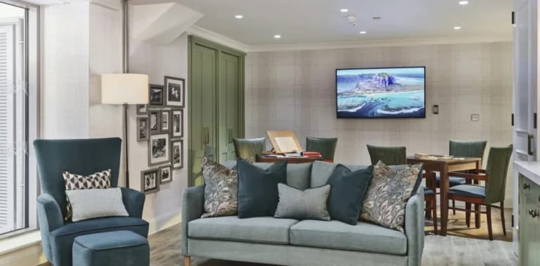 A cozy common area with seating and a television