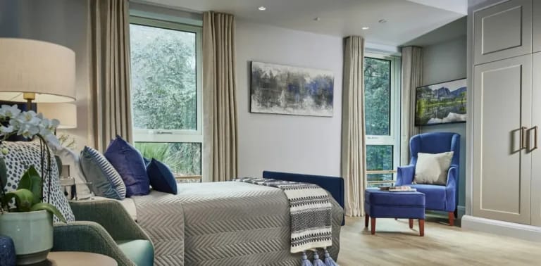 Bright, modern resident room with comfortable furnishings