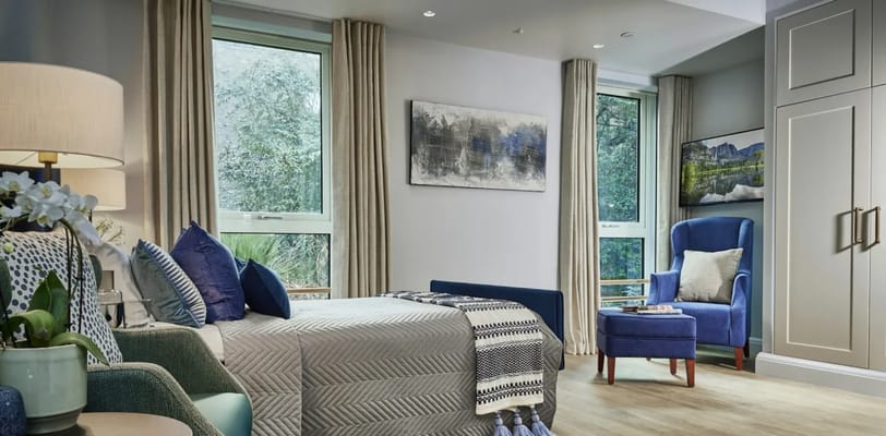 Bright, modern resident room with comfortable furnishings