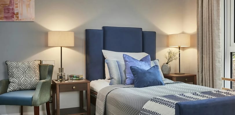 Cozy interior of a resident's room with decorative pillows