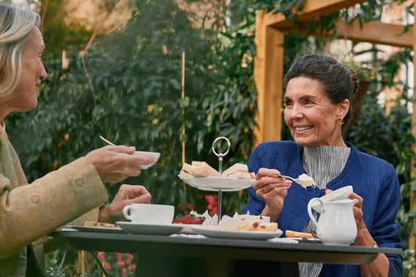 Residents enjoying afternoon tea in a garden