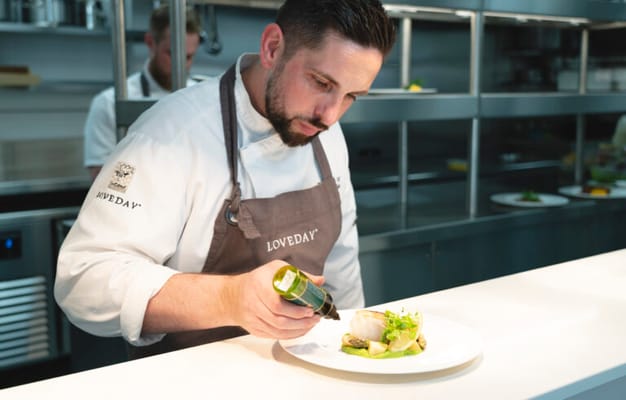 Chef preparing a gourmet dish in a kitchen