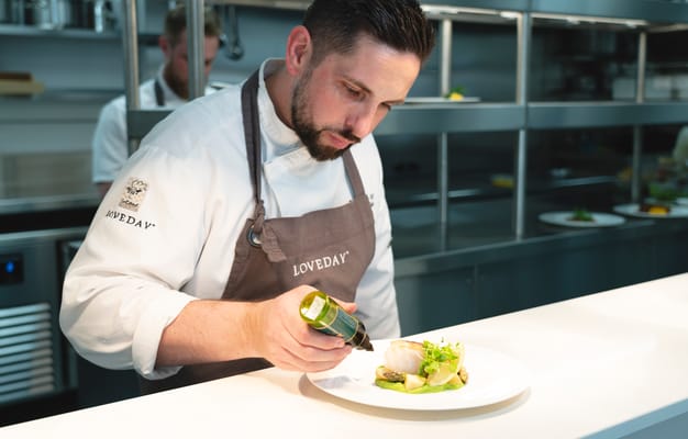 Chef preparing a gourmet dish in a kitchen