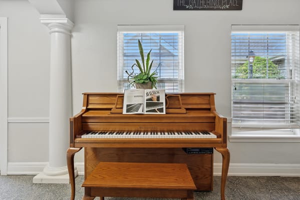 Piano decorated with plants in a common area