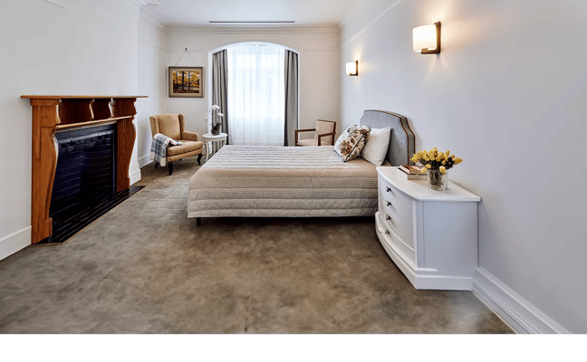 Cozy private resident room with bed and seating area