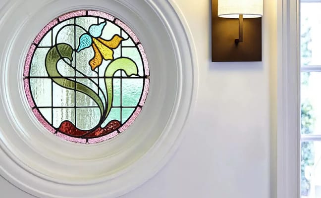 Stained glass window featuring a colorful floral design