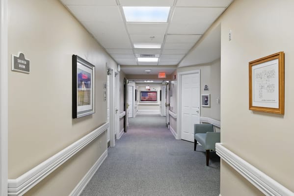 A corridor in an assisted living facility with signs
