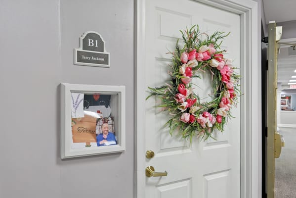 Doorway with personalized decor and wreath