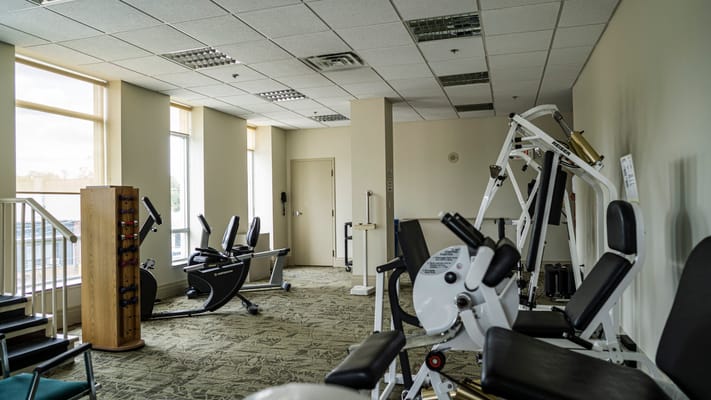 Well-equipped exercise room with various fitness machines