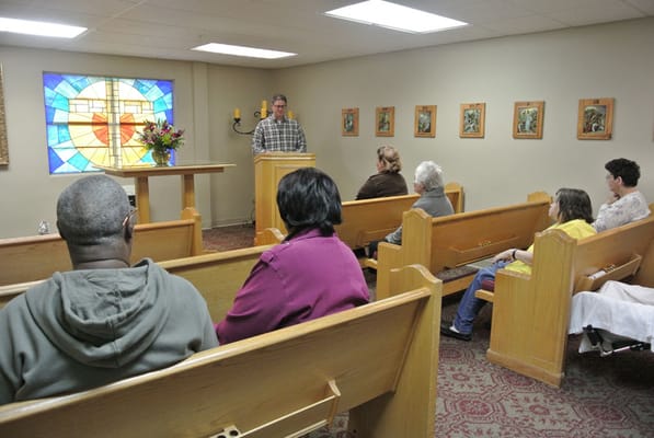 Residents attending a service in a chapel