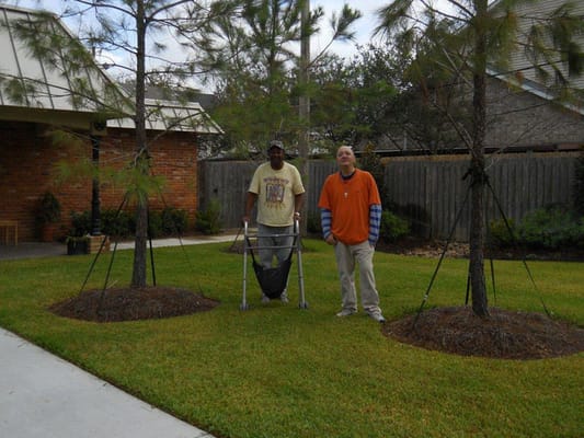 Two residents in a landscaped outdoor area