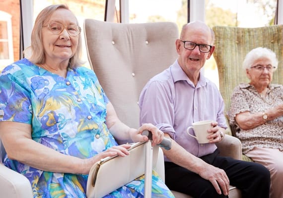 Residents enjoying a social moment in a sunny space