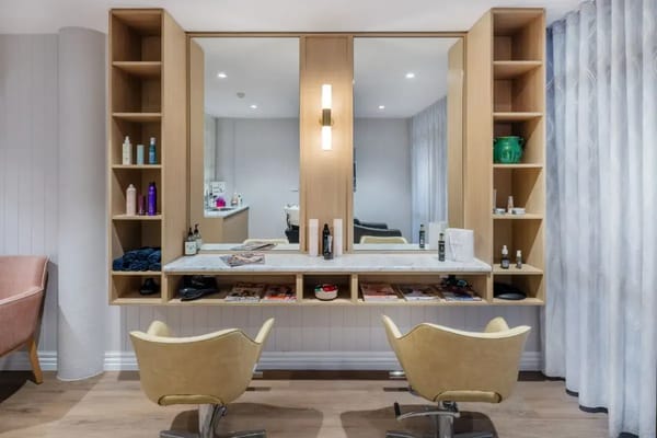 Well-equipped beauty salon area with mirrors