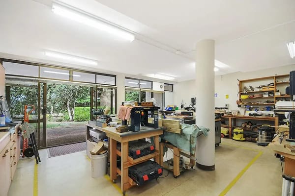 Workshop area with tools and materials visible