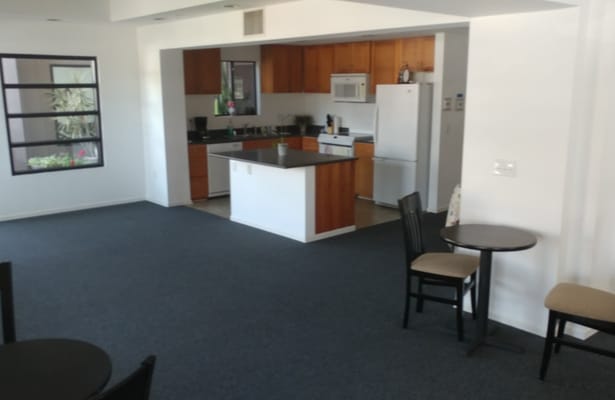 Common area with kitchen and dining tables