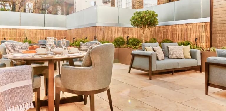 Outdoor dining area with tables and chairs