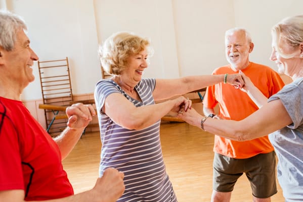 Seniors enjoying a group activity in a spacious room
