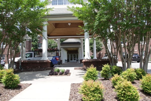 Entrance area with landscaped walkway and columns