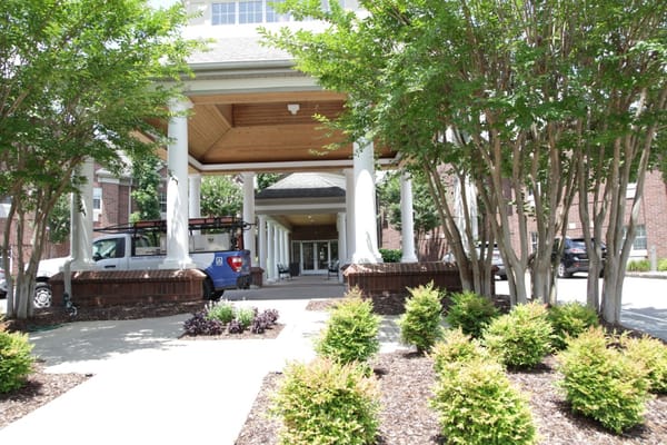 Main entrance of Blakeford at Green Hills with landscaped bushes