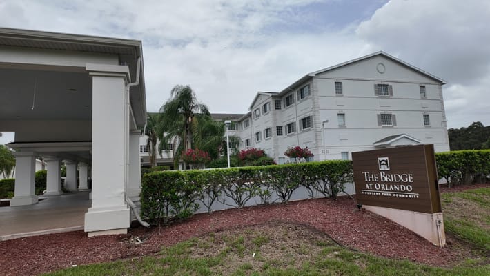Exterior of The Bridge at Orlando showing the main building and sign