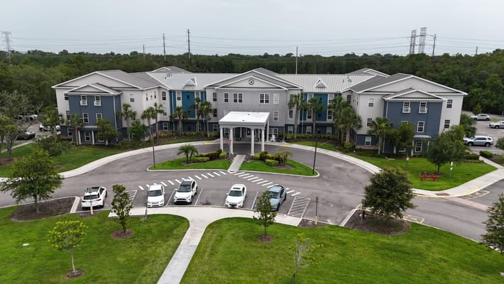 Aerial view of The Landings at Gentry Park entrance with parking area.