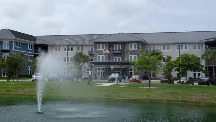 View of the fountain and building from the pond
