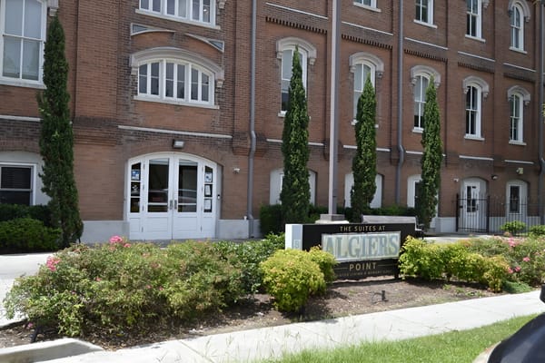 Exterior view of The Suites at Algiers Point building.