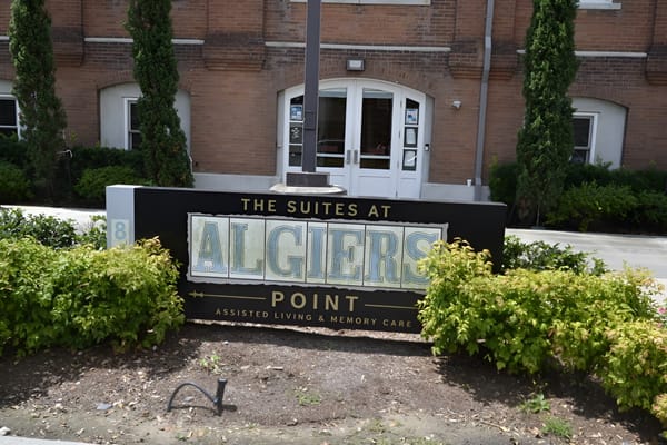 Exterior signage for The Suites at Algiers Point