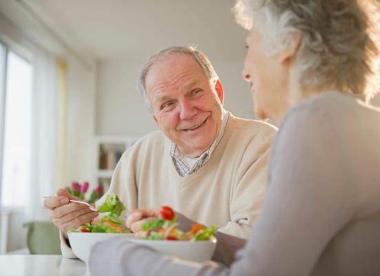 Two seniors enjoying a meal together