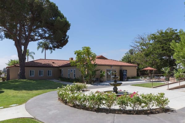 Exterior view of Arroyo Vista Nursing Center with garden