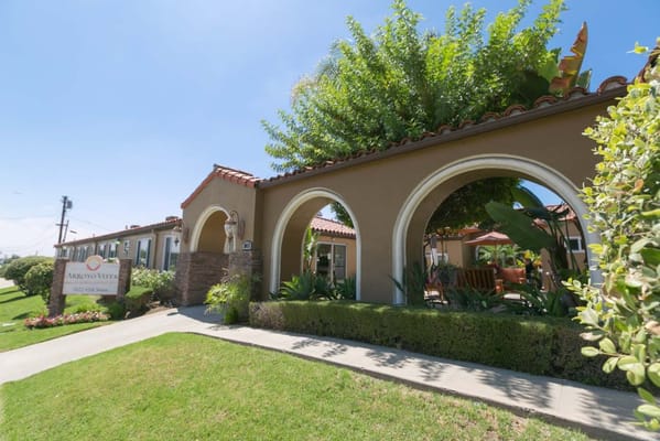 Entrance of the Arroyo Vista Nursing Center with lush greenery