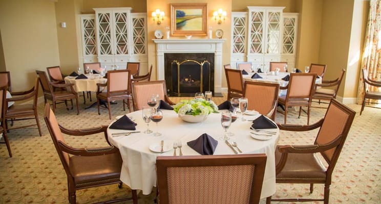 Elegant dining area with tables set for a meal