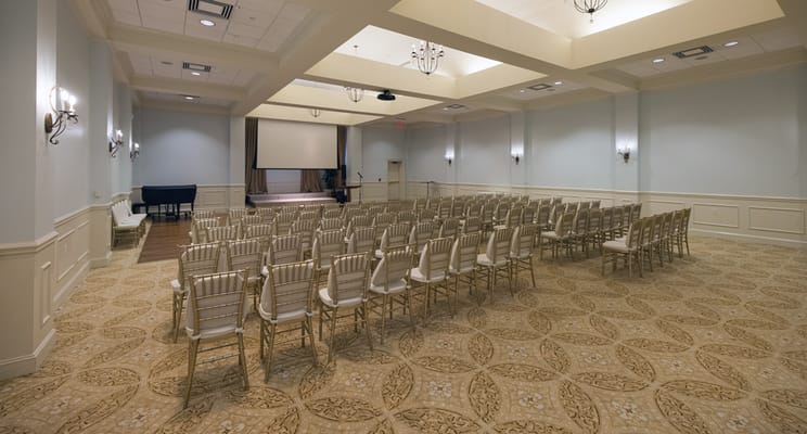 Empty event space with chairs set up for an event