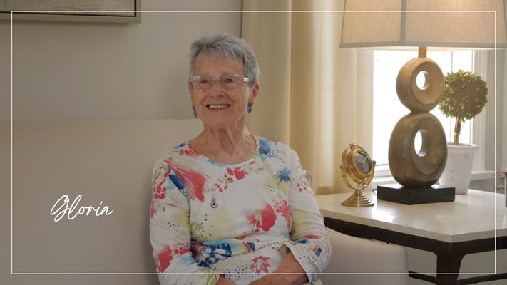 Resident smiling in a well-lit common area